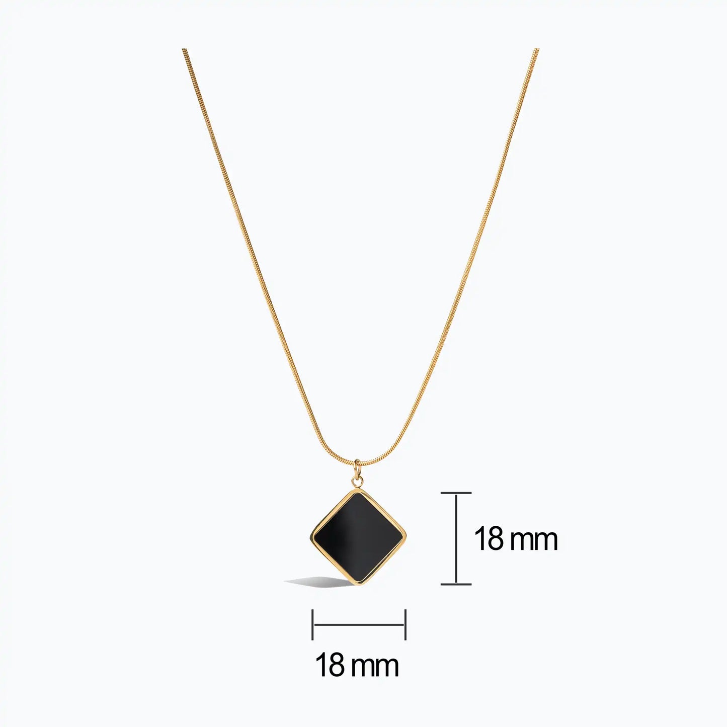 Gold snake chain necklace with a square black onyx pendant