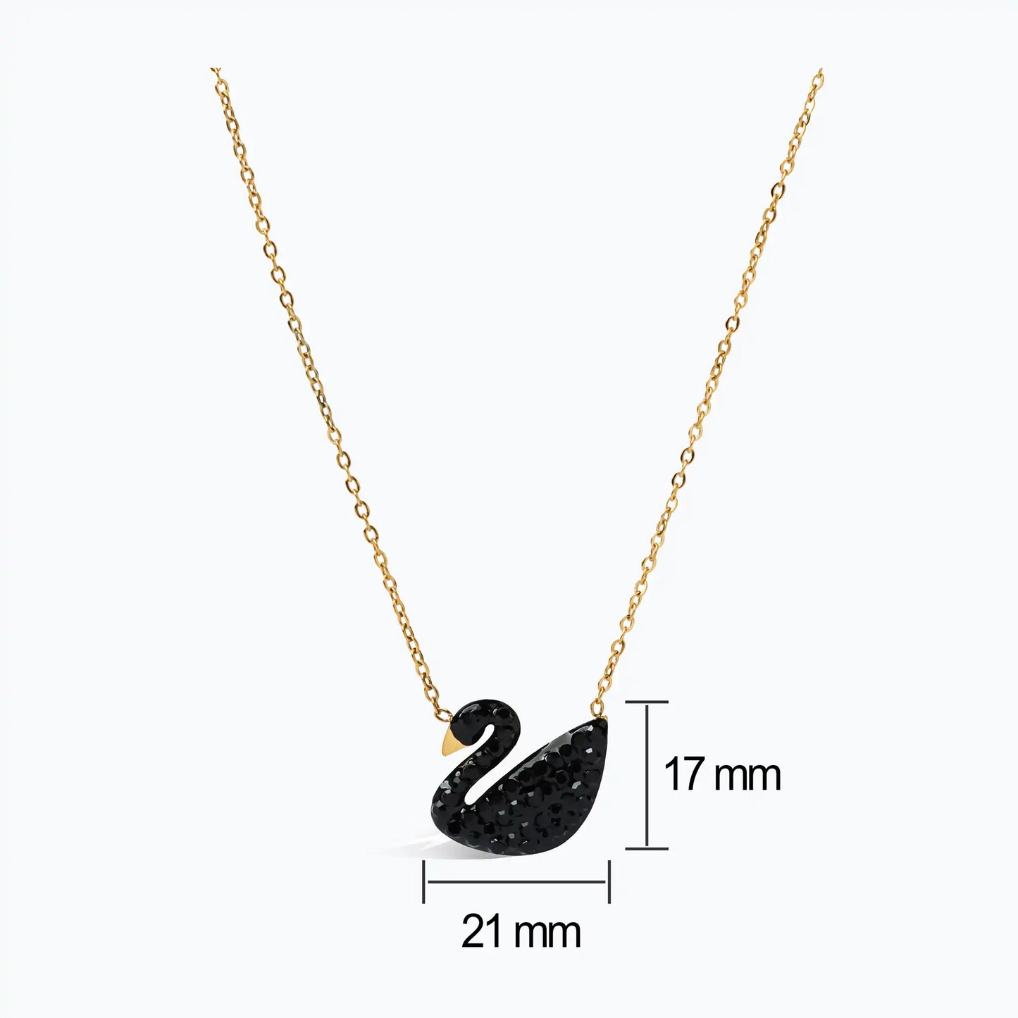 Elegant black swan necklace in gold, minimalist jewelry for women.