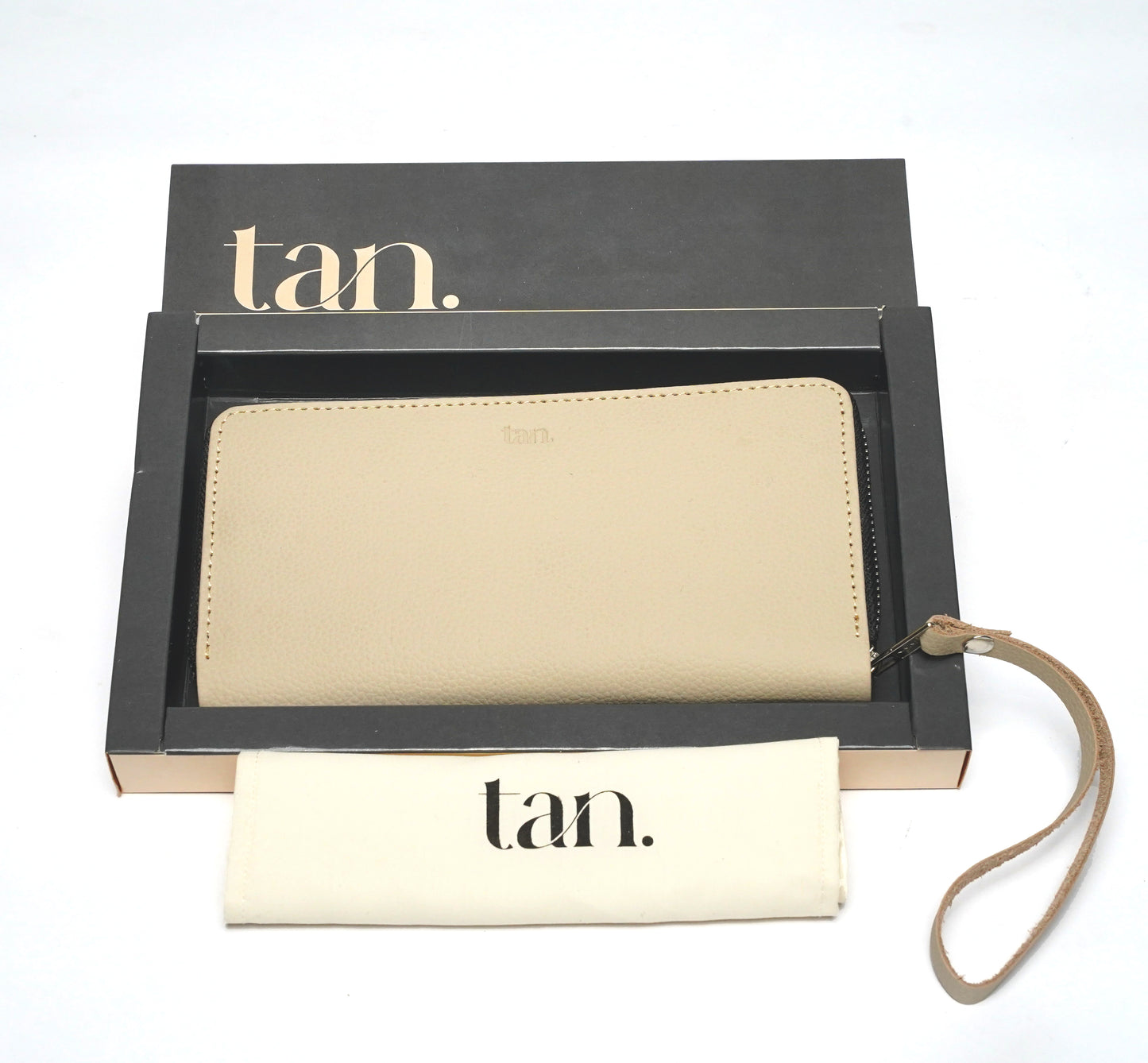 Beige leather zip-around wallet for women with wrist strap and branded gift box.