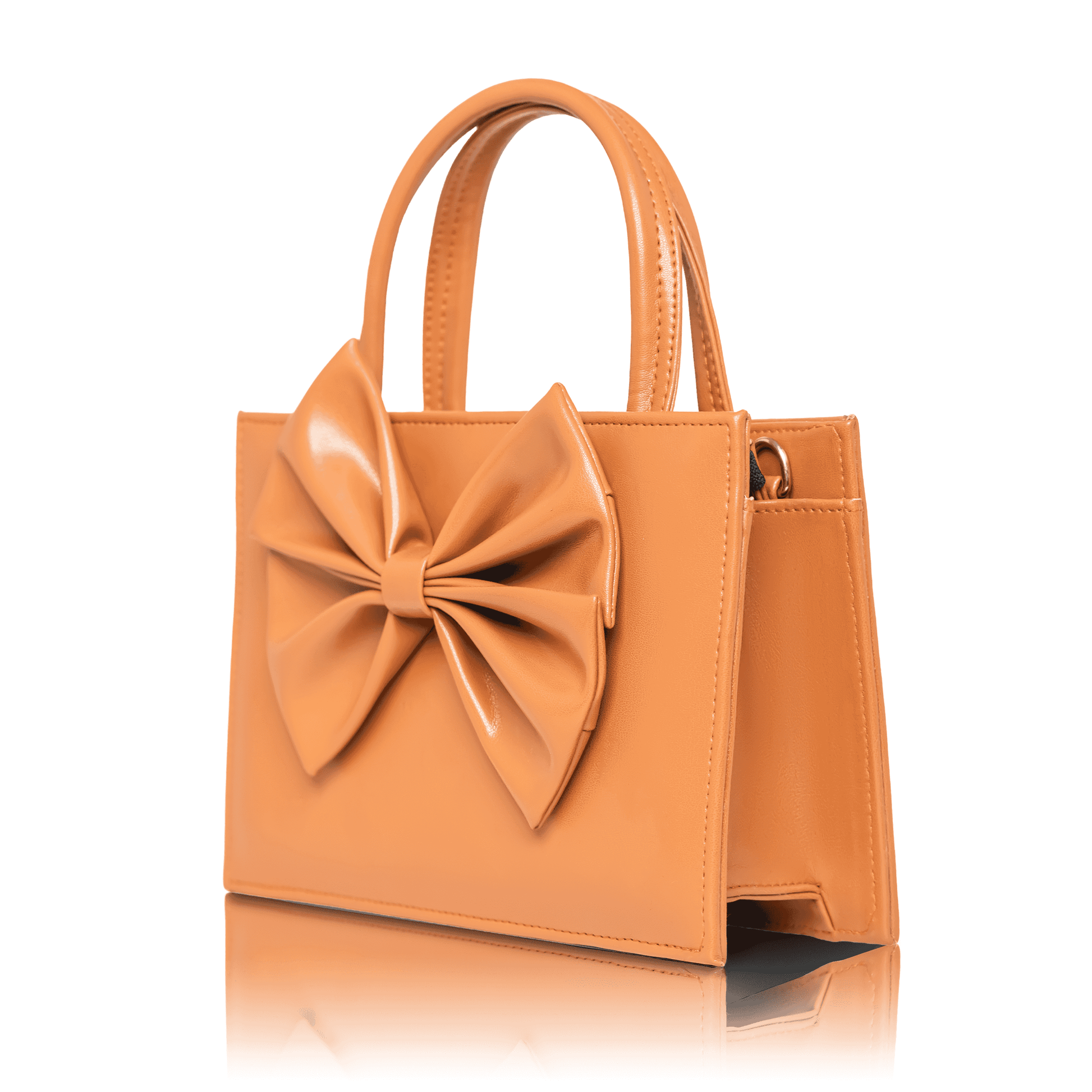 Coquette style camel brown mini bag with oversized bow detail and structured design.