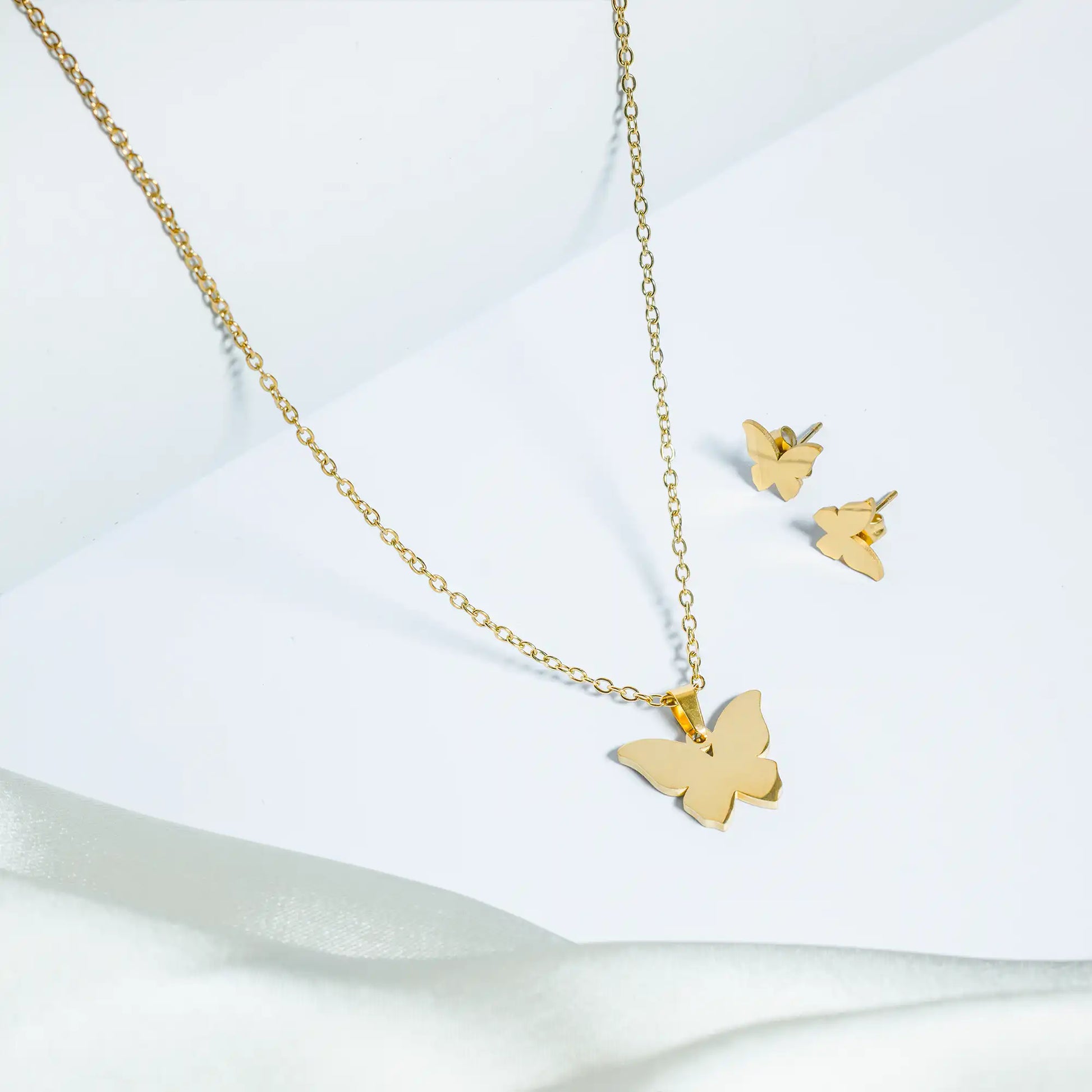 tan. butterfly golden necklace set with studs