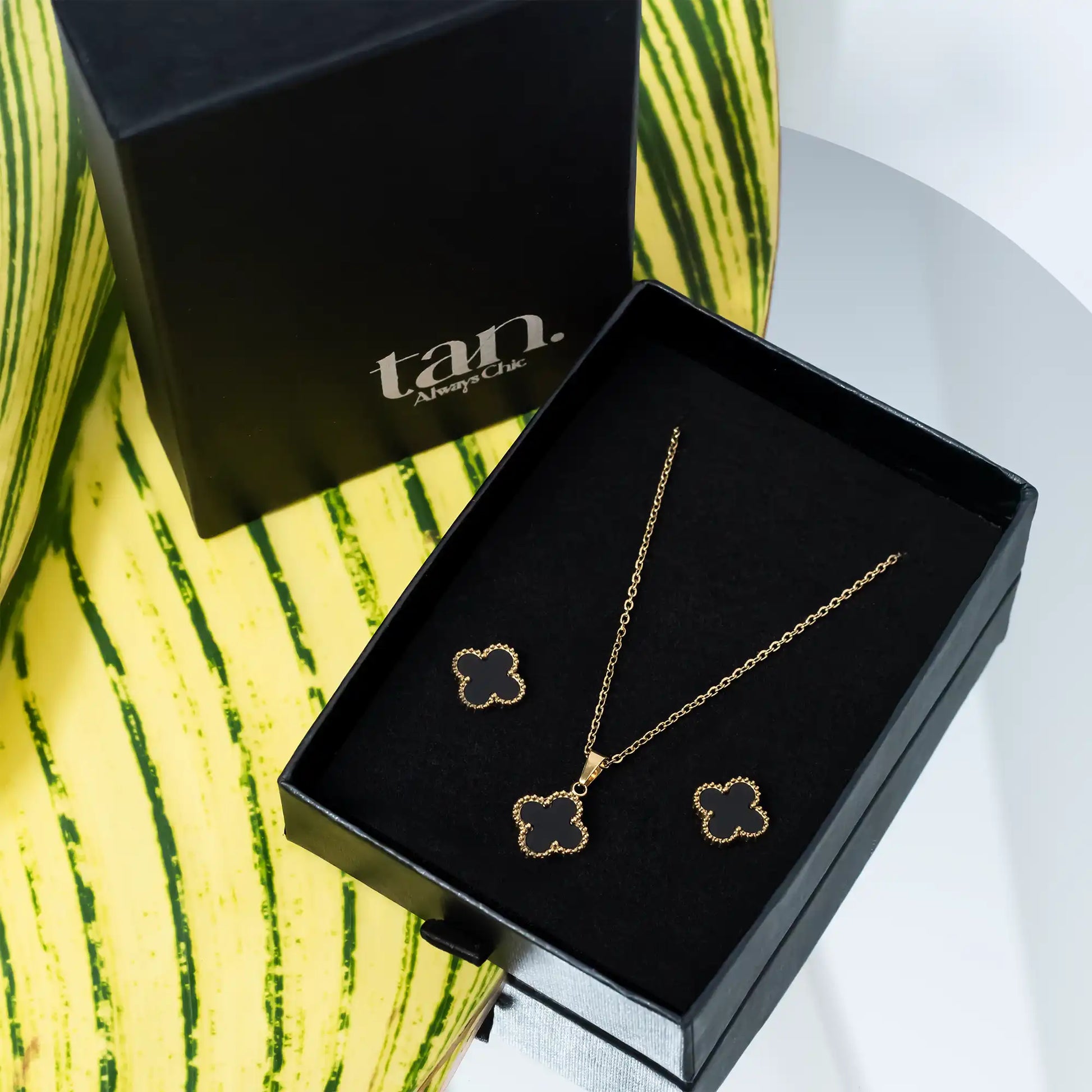 black clover pendant set with studs in black gift box by tanstore.pk