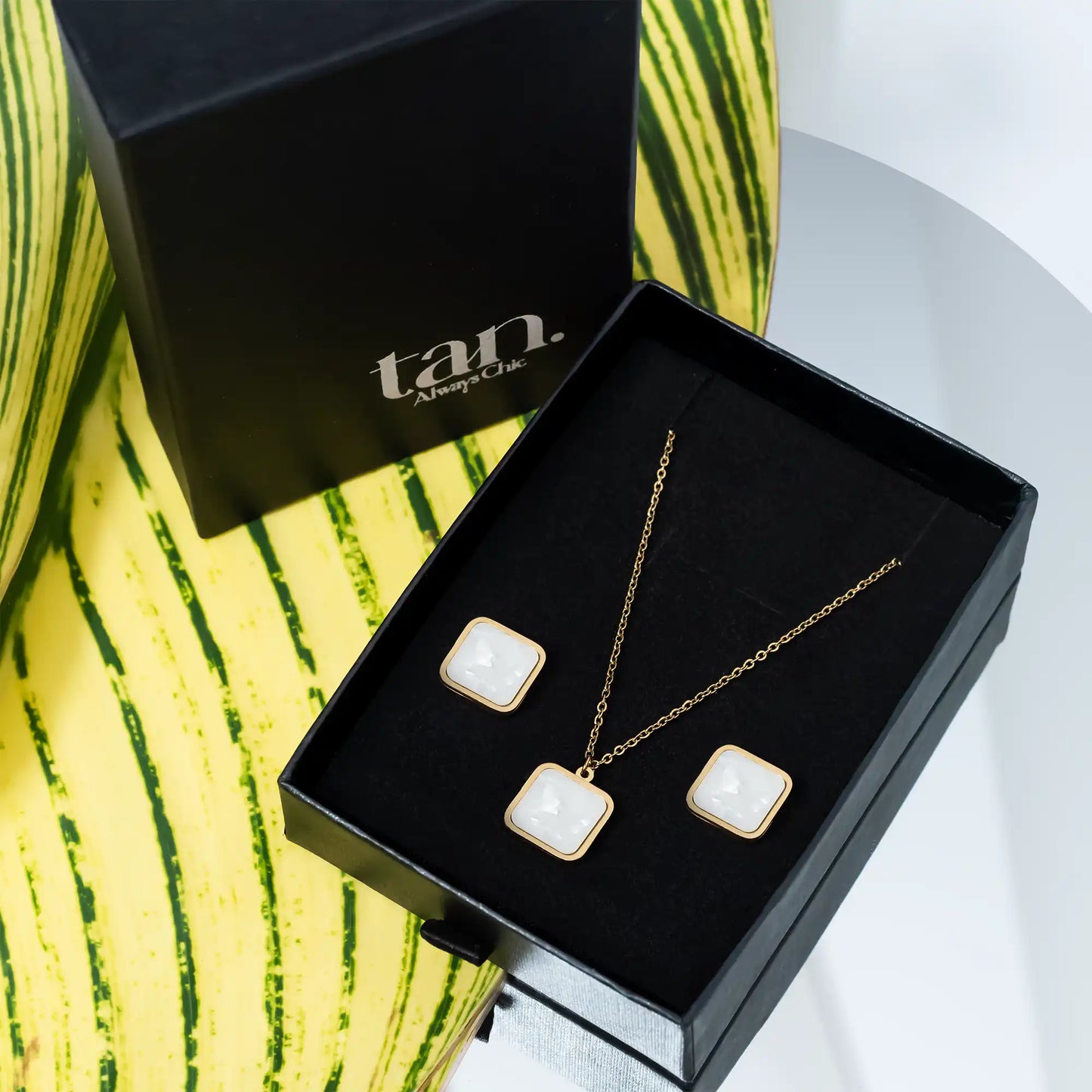 white stone inlay pendant set with studs in premium gift box by tan.