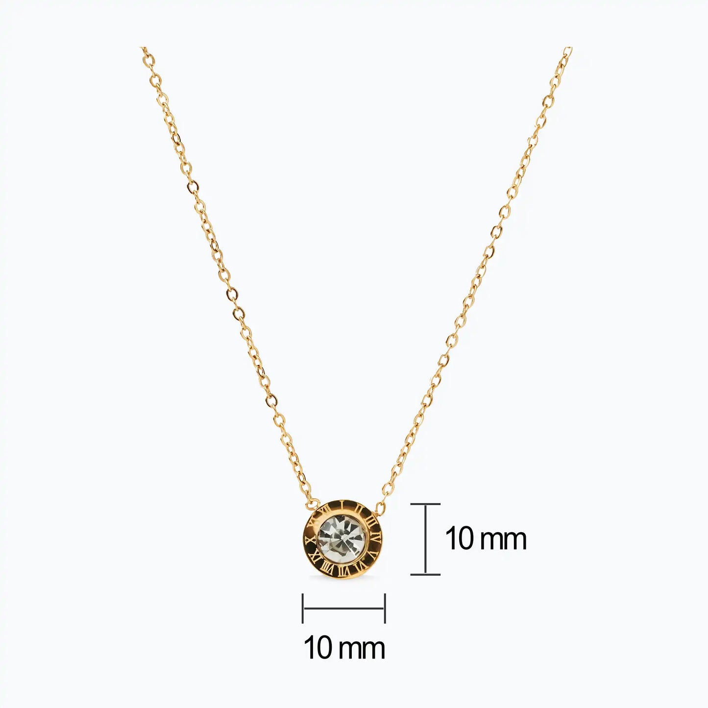 golden chain necklace with small circular pendant engraved with roman numbers and zircon stone
