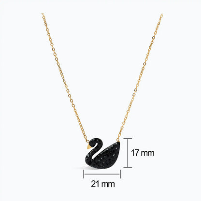 Elegant black swan necklace in gold, minimalist jewelry for women.
