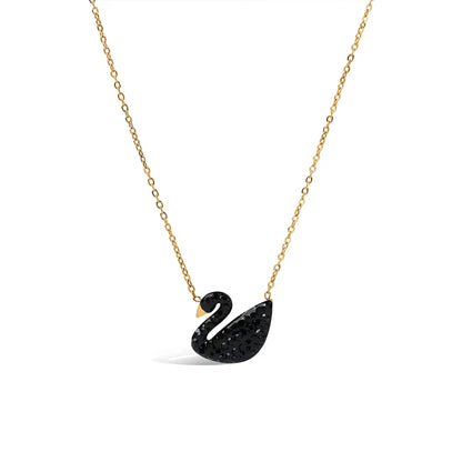 Dainty gold link necklace with a black pave crystal swan charm.