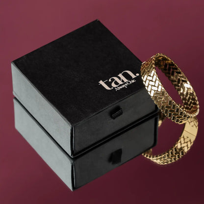 golden bangle bracelet for women with tan. branded gift box packaging