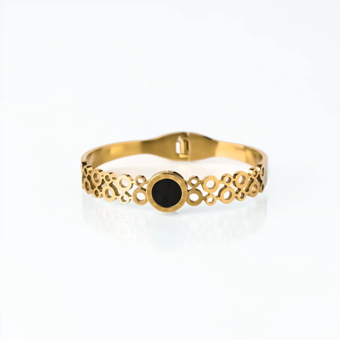 golden cuff for women with black dial and roman numeral detail