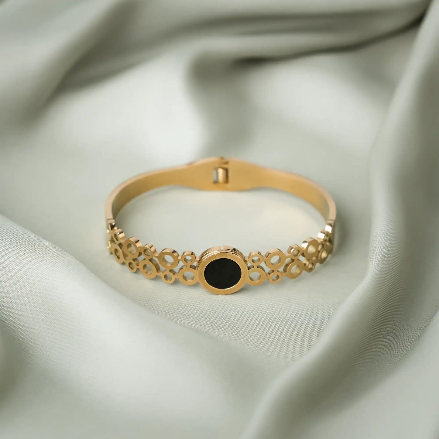 beautiful golden women's cuff bracelet with black stone inlay