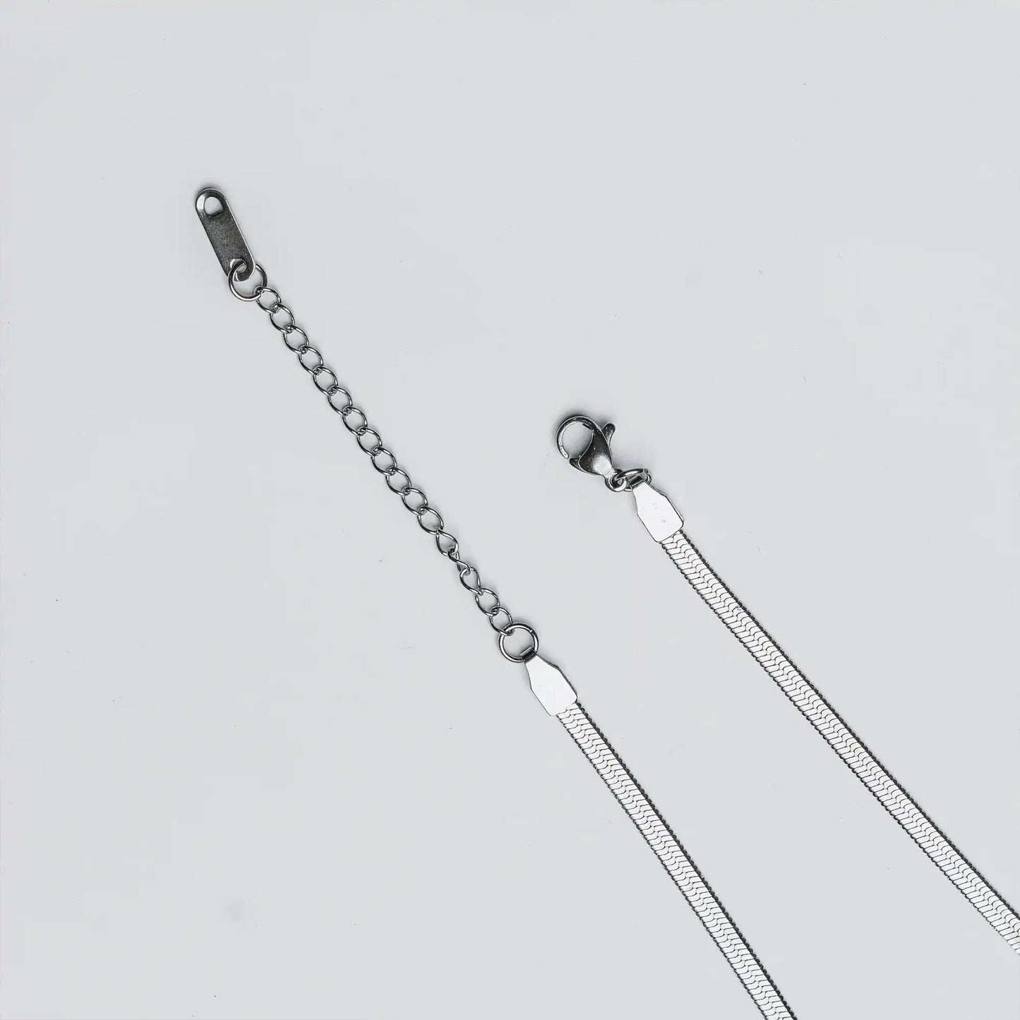 adjustable lock of tarnish-resistant silver snake chain anklet by tan.