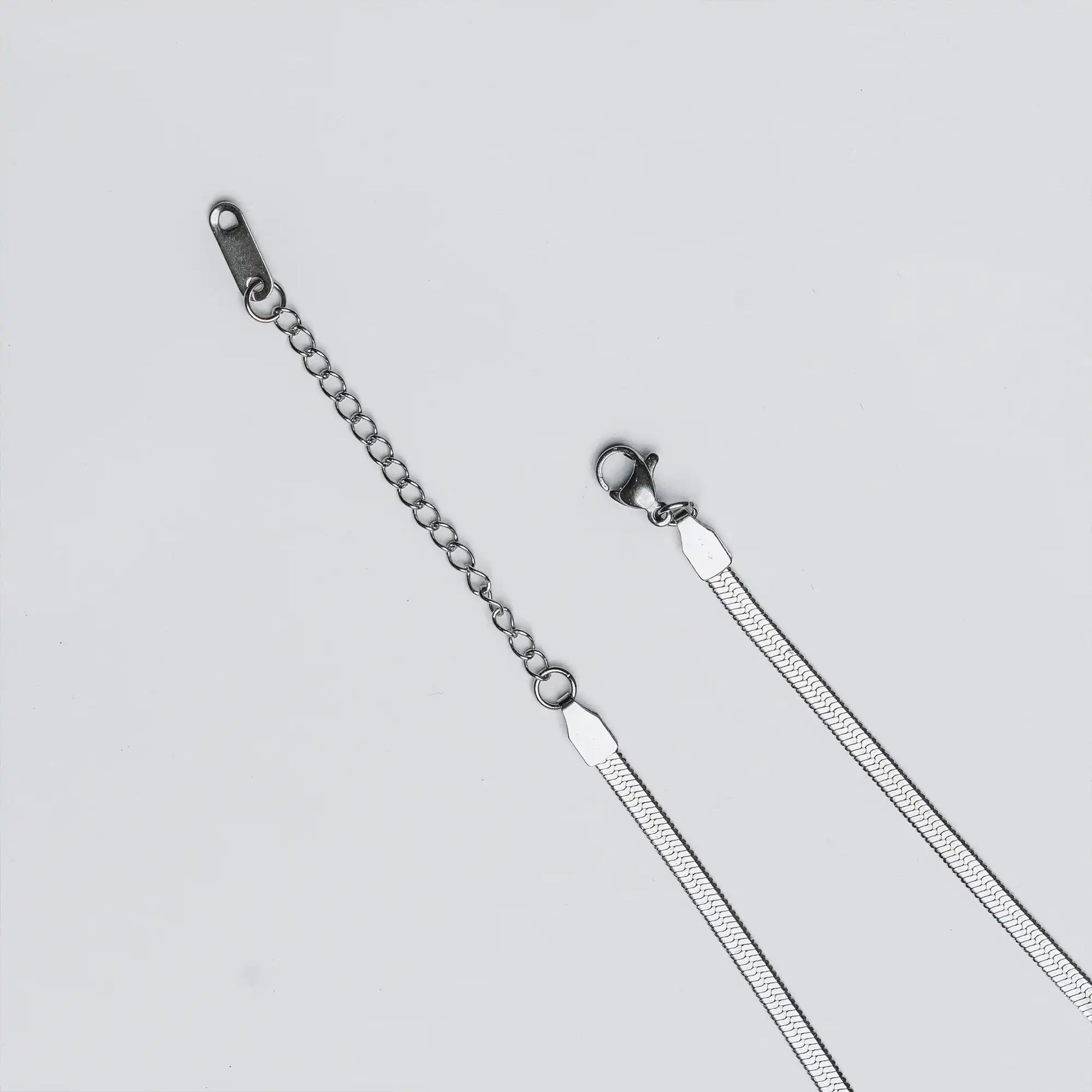 adjustable lock of tarnish-resistant silver snake chain anklet by tan.