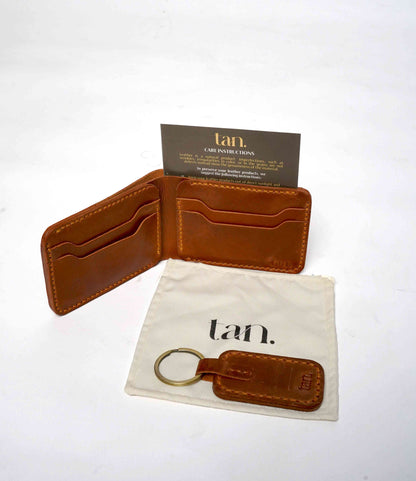 brown leather wallet and keychain gift set with care instructions by tan.