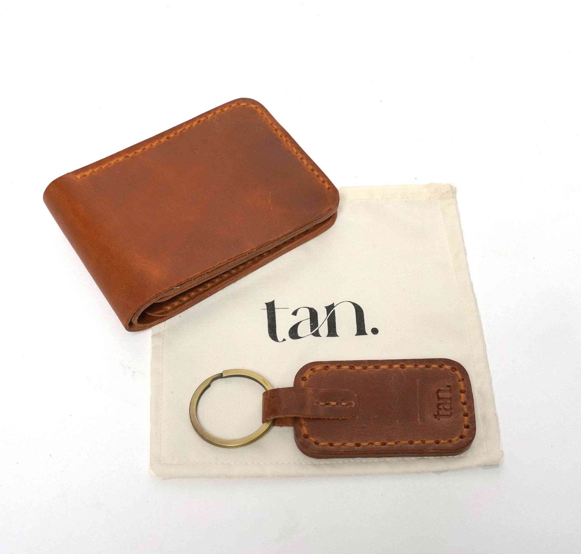 brown handstitched wallet with matcing keychain by tan.