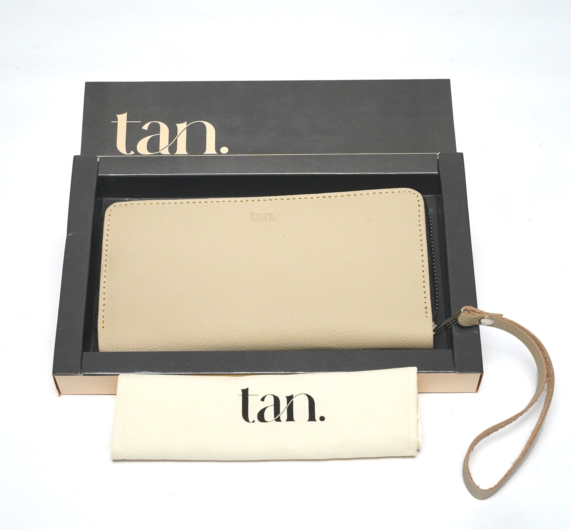 Beige leather zip-around wallet for women with wrist strap and branded gift box.